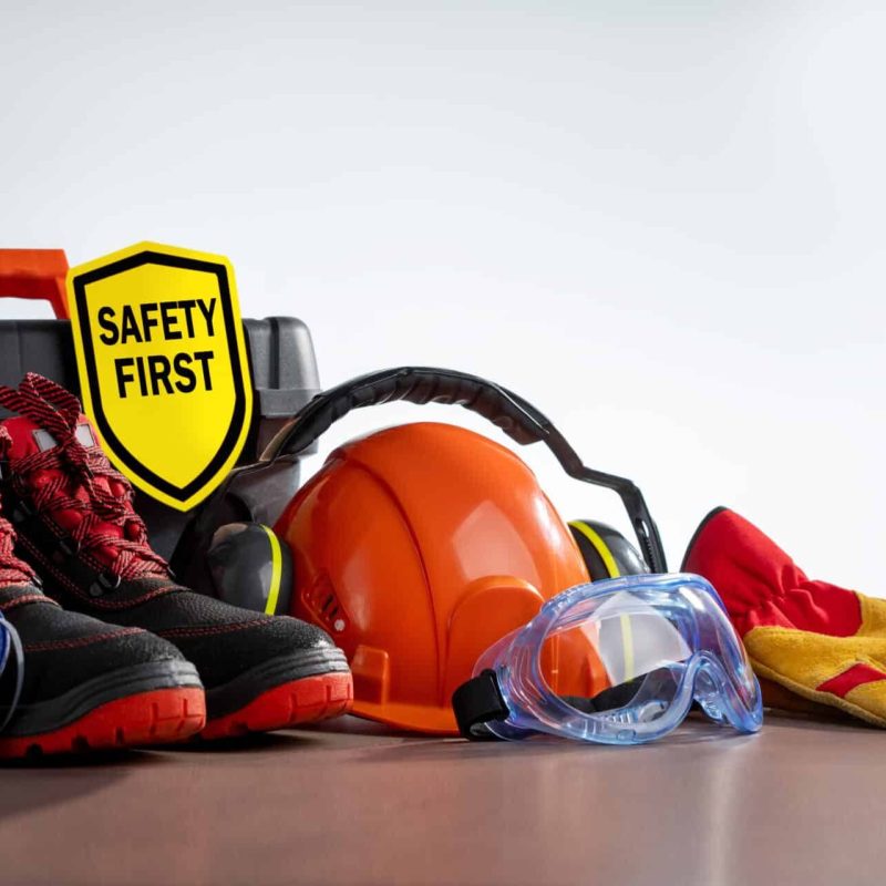 Work safety protection equipment on grey background with copy space. Horizontal banner.